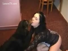 The teen sucks and licks the dog.